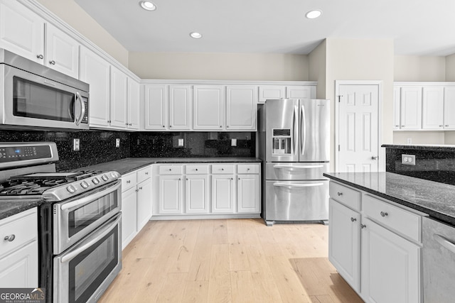 2030 Brook Meadow Dr, Alpharetta, GA 30005 - kitchen featuring appliances with stainless steel finishes, white cabinets, light wood-style flooring, recessed lighting, and dark stone counters