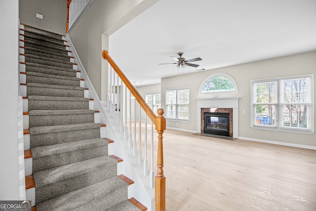 2030 Brook Meadow Dr, Alpharetta, GA 30005 - stairs featuring a ceiling fan, wood finished floors, and a high end fireplace
