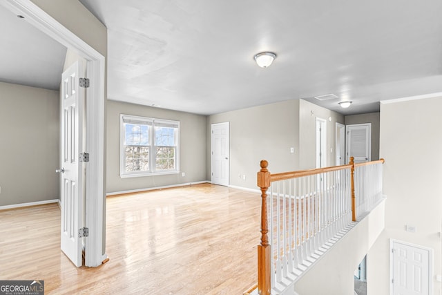 2030 Brook Meadow Dr, Alpharetta, GA 30005 - hall featuring wood finished floors and an upstairs landing