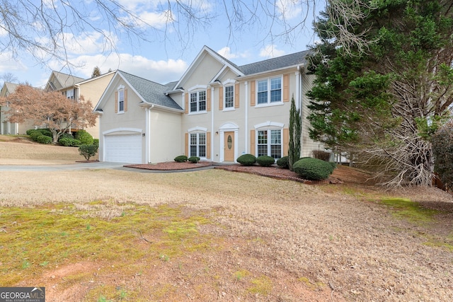 2030 Brook Meadow Dr, Alpharetta, GA 30005 - view of front of house with a garage, driveway, stucco siding, and a front yard