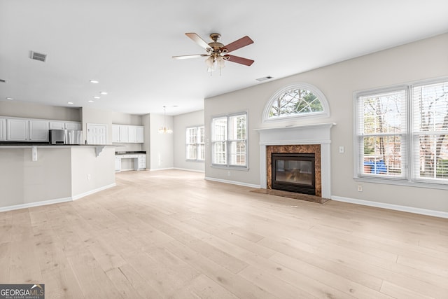 2030 Brook Meadow Dr, Alpharetta, GA 30005 - unfurnished living room featuring a ceiling fan, a fireplace, light wood-type flooring, and recessed lighting