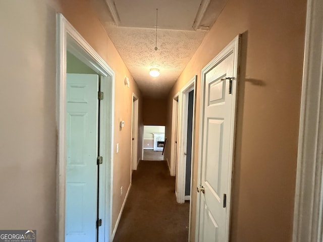 270 Mountain Way, Covington, GA 30016 - hall with attic access, a textured ceiling, and baseboards