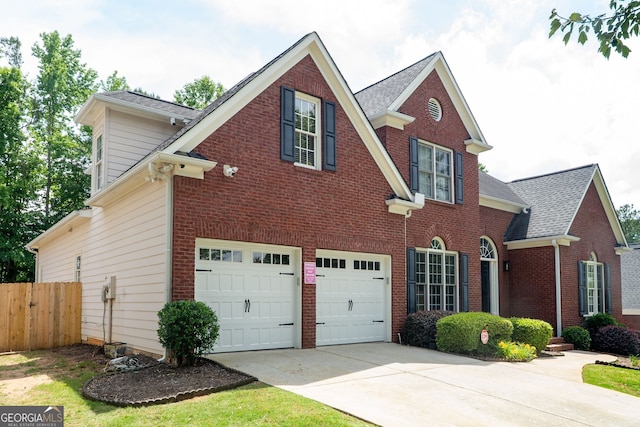 4046 Creekview Ridge Dr, Buford, GA 30518 - traditional home with a garage, concrete driveway, and brick siding