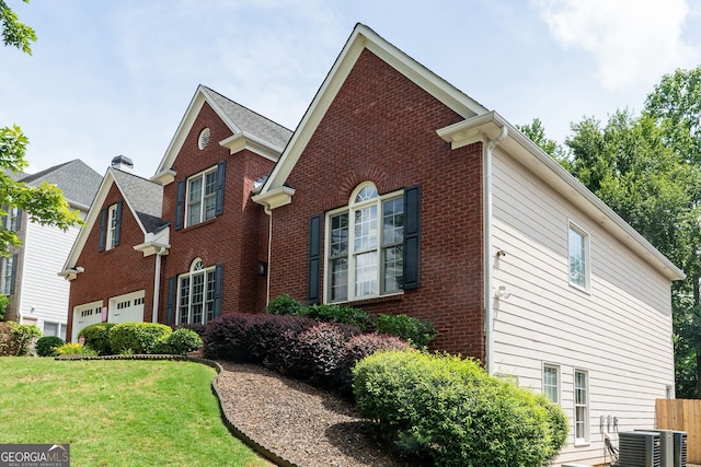 4046 Creekview Ridge Dr, Buford, GA 30518 - view of home's exterior with brick siding, a lawn, and an attached garage