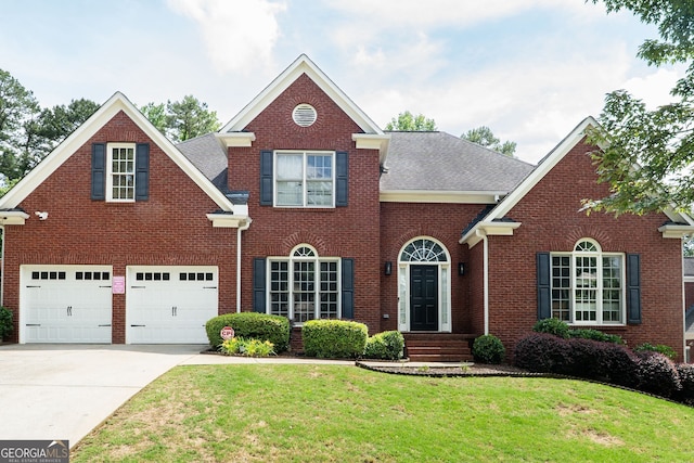 4046 Creekview Ridge Dr, Buford, GA 30518 - view of front of property with driveway, a front yard, brick siding, and a shingled roof