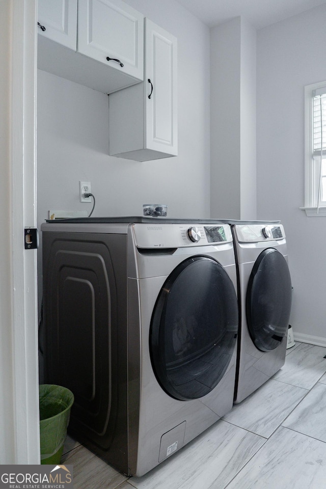 4046 Creekview Ridge Dr, Buford, GA 30518 - laundry room featuring cabinet space and washing machine and dryer