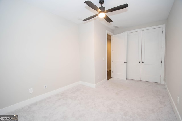 1 Newnan Views Cir, Newnan, GA 30263 - unfurnished bedroom featuring carpet floors, baseboards, a closet, and ceiling fan