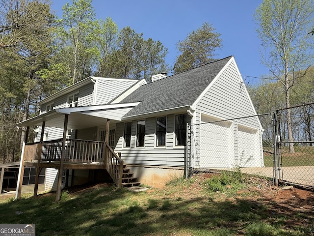 8310 Jensen Trl, Gainesville, GA 30506 - view of front of property with a chimney, roof with shingles, a garage, and a gate