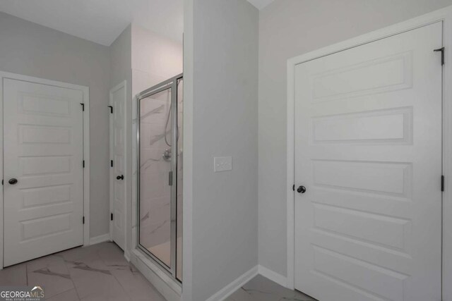 420 Tavistock Ct, Mcdonough, GA 30252 - full bath with marble finish flooring, a marble finish shower, and baseboards