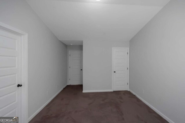 420 Tavistock Ct, Mcdonough, GA 30252 - unfurnished bedroom featuring carpet floors, baseboards, and a closet