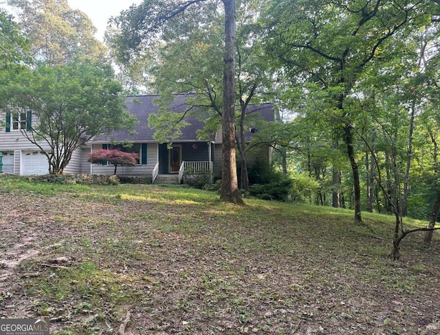 264 E Boling Rd, Jasper, GA 30143 - view of front of house featuring a porch, a garage, and roof with shingles