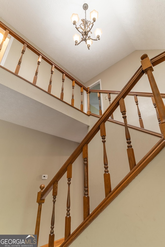 264 E Boling Rd, Jasper, GA 30143 - stairway featuring a chandelier and lofted ceiling