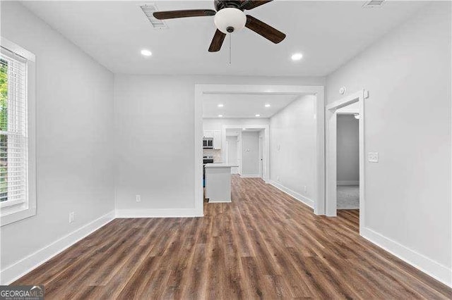 2209 Browns Mill Rd SE, Atlanta, GA 30315 - unfurnished living room with ceiling fan, baseboards, wood finished floors, and recessed lighting