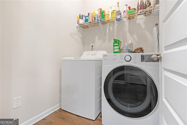 1152 Werre Way, Locust Grove, GA 30248 - laundry area featuring washing machine and clothes dryer, wood finished floors, and baseboards