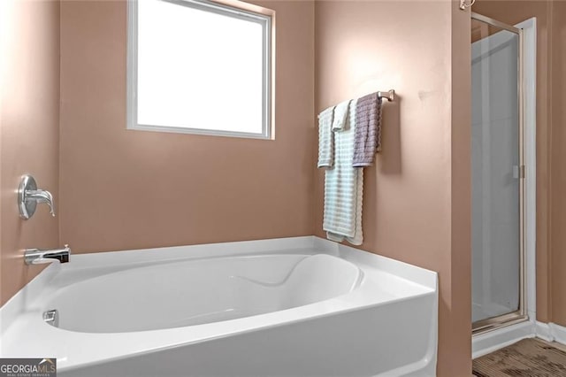 1152 Werre Way, Locust Grove, GA 30248 - bathroom with a shower stall and a garden tub