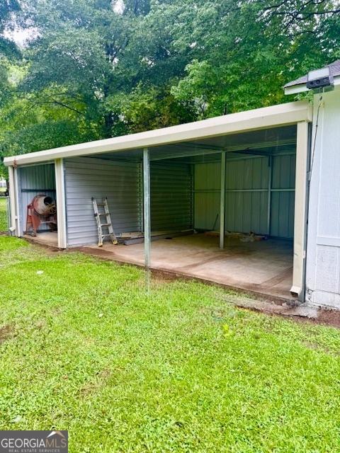 219 Broad St, Carrollton, GA 30117 - view of vehicle parking featuring a carport