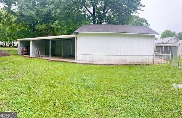 219 Broad St, Carrollton, GA 30117 - rear view of house with a lawn