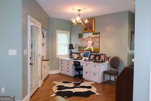 1101 Forrest Hills Dr, Watkinsville, GA 30677 - office featuring light wood-style flooring and a chandelier