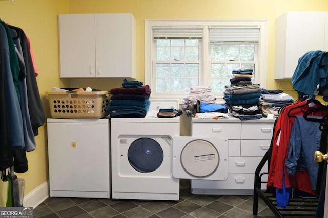 1101 Forrest Hills Dr, Watkinsville, GA 30677 - laundry room with washer and dryer, cabinet space, and dark tile patterned floors