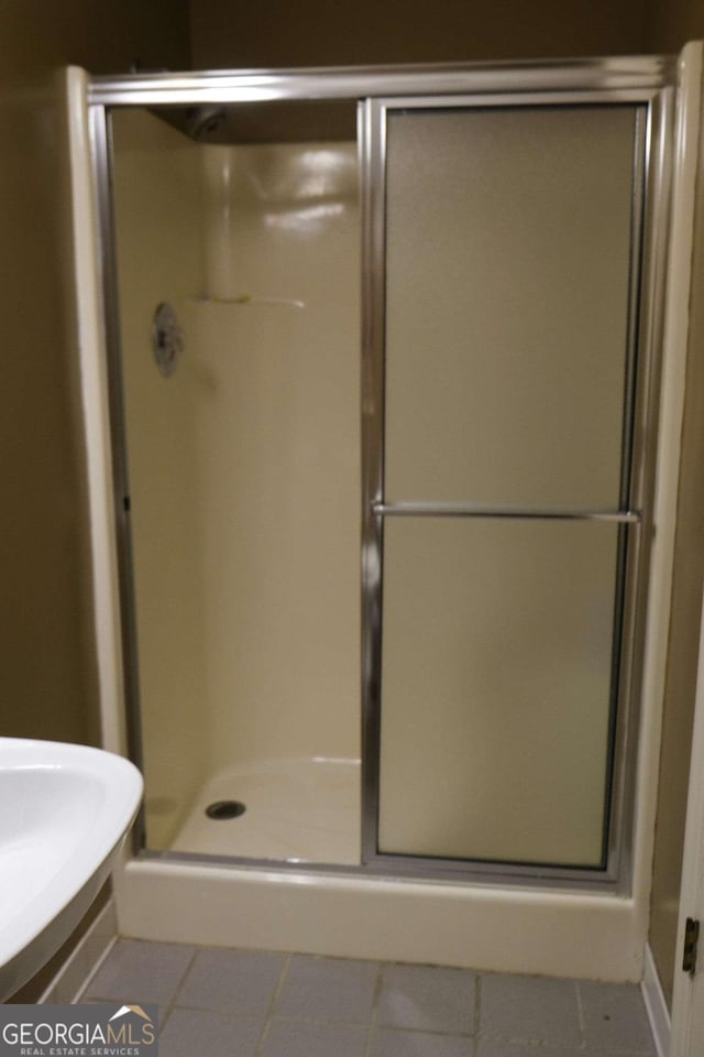 1101 Forrest Hills Dr, Watkinsville, GA 30677 - bathroom featuring tile patterned floors and a stall shower