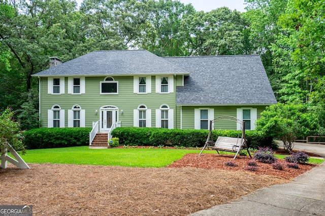 3010 White Oak Ct, Lagrange, GA 30240 - colonial-style house featuring a shingled roof, a chimney, and a front lawn
