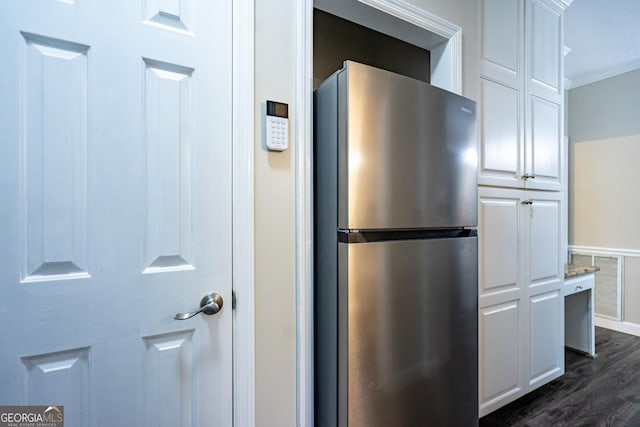 3010 White Oak Ct, Lagrange, GA 30240 - kitchen view of freestanding refrigerator, dark wood-style flooring, white cabinetry, and crown molding