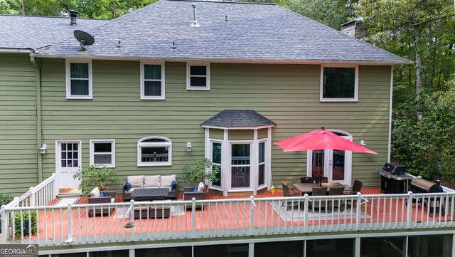 3010 White Oak Ct, Lagrange, GA 30240 - back of property with an outdoor living space, a deck, outdoor dining area, and a chimney