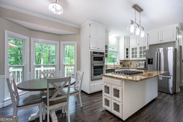 3010 White Oak Ct, Lagrange, GA 30240 - kitchen featuring stainless steel appliances, white cabinets, ornamental molding, a kitchen island, and glass insert cabinets