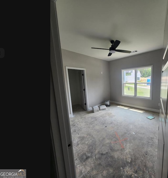 107 Silver Maple Ct, Byron, GA 31008 - unfurnished bedroom featuring concrete floors and ceiling fan