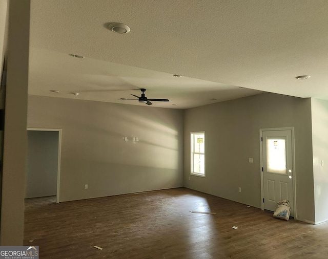 107 Silver Maple Ct, Byron, GA 31008 - unfurnished living room with wood finished floors, a textured ceiling, and ceiling fan