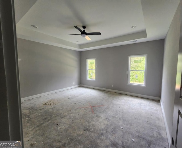 107 Silver Maple Ct, Byron, GA 31008 - empty room featuring a raised ceiling, baseboards, and a ceiling fan