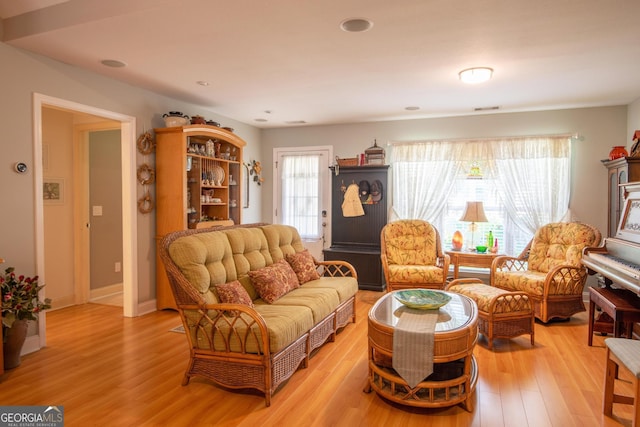 1042 Moss Creek Cir, Statesboro, GA 30461 - living room featuring light wood-type flooring and recessed lighting