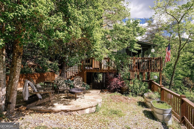 174 Little Rock Creek Ct, Cherry Log, GA 30522 - view of yard featuring stairway, an outdoor fire pit, a wooden deck, and a patio area