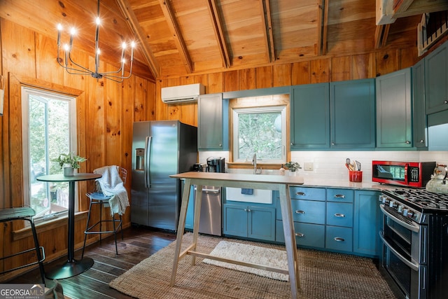 174 Little Rock Creek Ct, Cherry Log, GA 30522 - kitchen featuring appliances with stainless steel finishes, a wall mounted air conditioner, wood walls, plenty of natural light, and dark wood finished floors