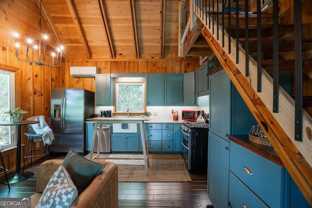 174 Little Rock Creek Ct, Cherry Log, GA 30522 - kitchen with stainless steel appliances, wood ceiling, a chandelier, wooden walls, and dark wood-style floors