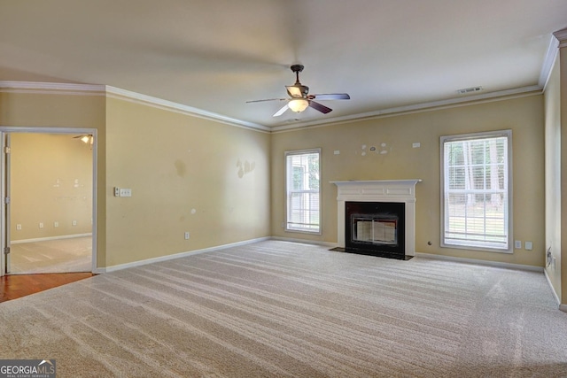 1132 Hargrove Ct, Locust Grove, GA 30248 - unfurnished living room with carpet, crown molding, ceiling fan, and a fireplace with flush hearth