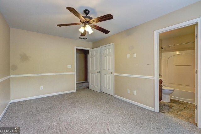 1132 Hargrove Ct, Locust Grove, GA 30248 - unfurnished bedroom featuring baseboards, carpet floors, and connected bathroom