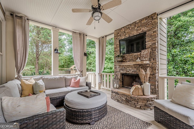 4096 Vinings Mill Trl SE, Smyrna, GA 30080 - sunroom / solarium with an outdoor living space with a fireplace, a ceiling fan, and plenty of natural light