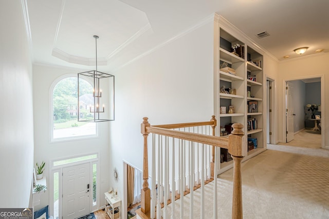 4096 Vinings Mill Trl SE, Smyrna, GA 30080 - entryway with a chandelier, ornamental molding, carpet floors, and a raised ceiling
