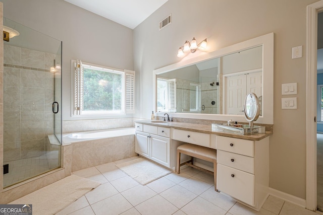 4096 Vinings Mill Trl SE, Smyrna, GA 30080 - bathroom featuring tile patterned flooring, double vanity, a stall shower, and a bath