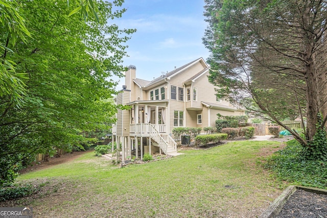 4096 Vinings Mill Trl SE, Smyrna, GA 30080 - back of property with a chimney and central air condition unit