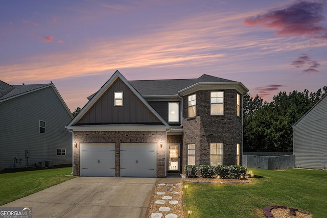 210 Kestrel Cir, Covington, GA 30014 - view of front of house with board and batten siding, concrete driveway, a garage, brick siding, and a shingled roof