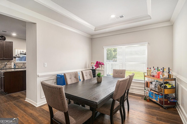210 Kestrel Cir, Covington, GA 30014 - dining area with a tray ceiling, dark wood-style floors, and crown molding