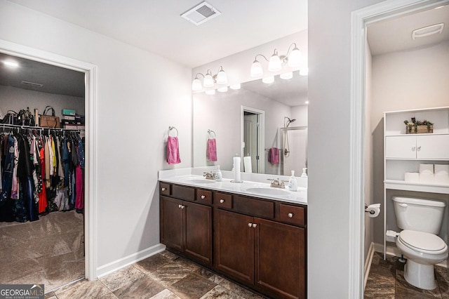 210 Kestrel Cir, Covington, GA 30014 - bathroom with double vanity and a walk in closet
