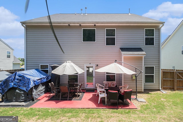 210 Kestrel Cir, Covington, GA 30014 - back of house featuring a patio area