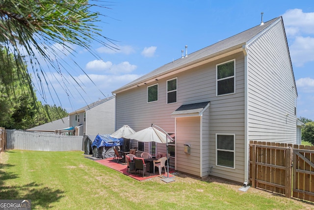 210 Kestrel Cir, Covington, GA 30014 - rear view of house with a fenced backyard and a patio area