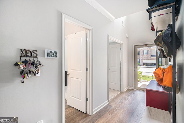 210 Kestrel Cir, Covington, GA 30014 - corridor featuring wood finished floors and baseboards