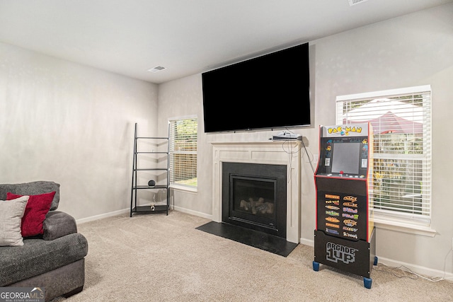 210 Kestrel Cir, Covington, GA 30014 - carpeted living area featuring a fireplace with flush hearth and baseboards