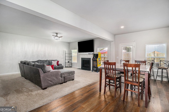 210 Kestrel Cir, Covington, GA 30014 - dining space featuring dark wood-style flooring, a fireplace with flush hearth, and recessed lighting