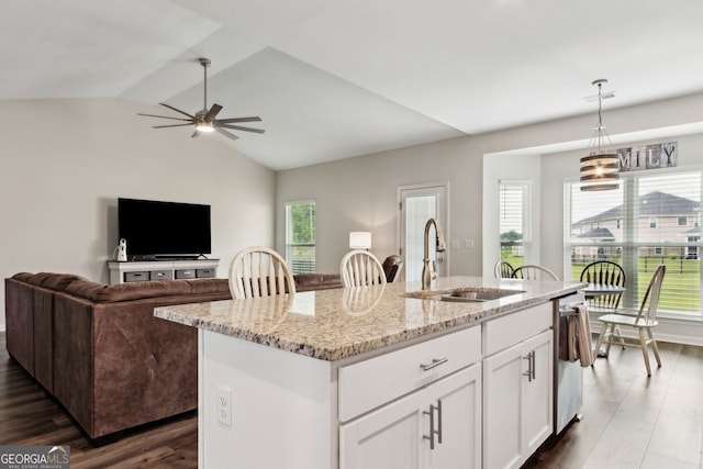 102 Olson Way, Kingsland, GA 31548 - kitchen with a sink, dishwasher, light stone countertops, a center island with sink, and decorative light fixtures